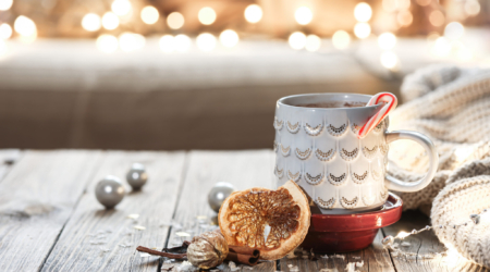 christmas-cup-with-hot-drink-blurred-background-with-bokeh-2048x1273